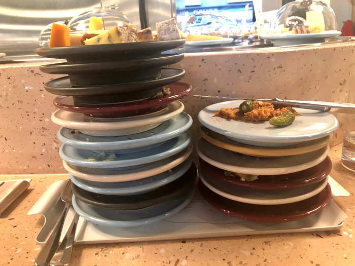 We stacked up all our plates, putting the bits of cheeses and meats that we couldn