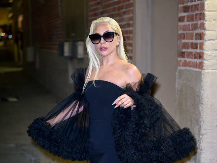 Lady Gaga added some drama to a strapless minidress for a late-night appearance in January 2022.