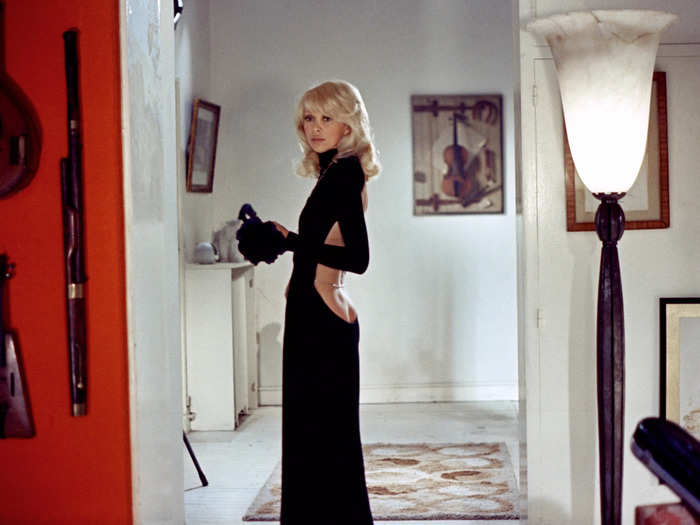 In the 1972 film "Le Grand Blond avec une chaussure noire" (which translates to "The Tall Blond Man with One Black Shoe" in English), actress Mireille Darc wore a deep-cut, backless dress that stole the show.