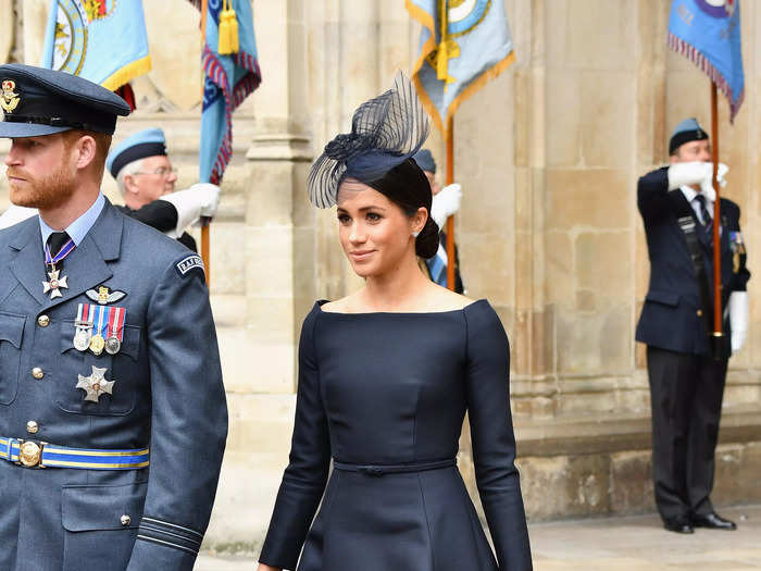 Meghan Markle looked timeless and elegant in a black fit-and-flare dress in 2018.