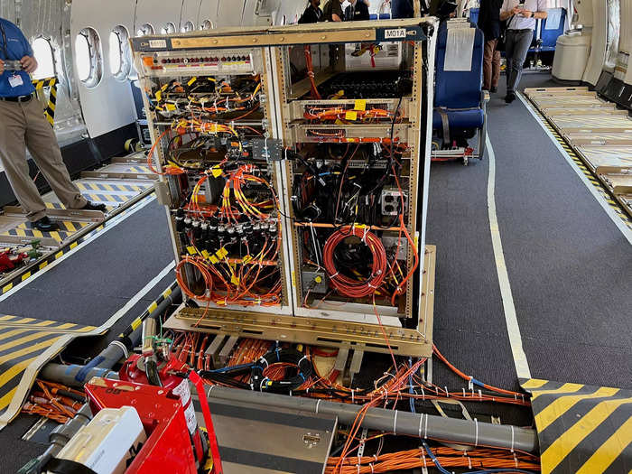 A lot of the instrumentation, like orange wiring throughout the cabin, is purely used for testing and is not in production aircraft. It sends information to the engineers so they can analyze data in real-time to ensure the plane is performing.