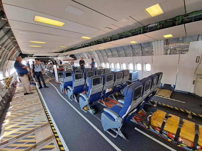 Behind the tanks are several rows of seats arranged as they would be in an economy class. These are for ferrying Boeing staff between test flights.