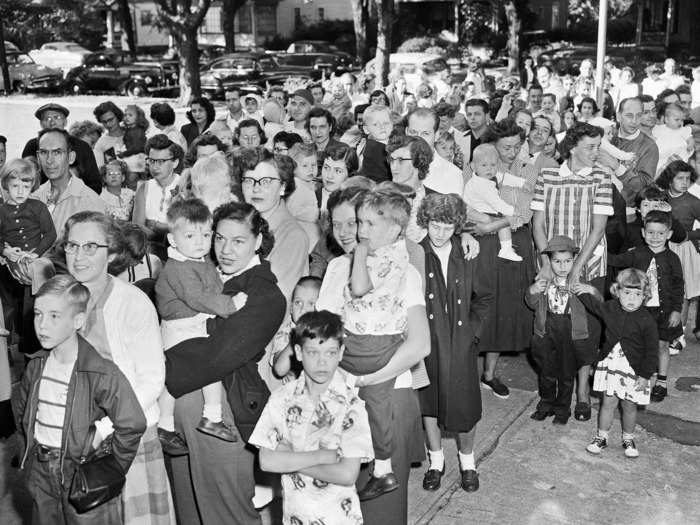 July 1, 1953: A line of children and parents wait to be immunized with gamma globulin, which later turned out to be ineffective at protecting against the disease.