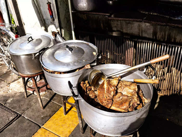 There were pots filled with meat in various parts of the restaurant — including right outside, by the sidewalk.