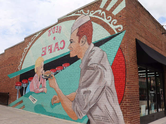 A mural shows a young Parton ordering a hamburger at Red