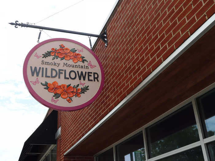 Across the street, a store called Smoky Mountain Wildflower references another Parton song.