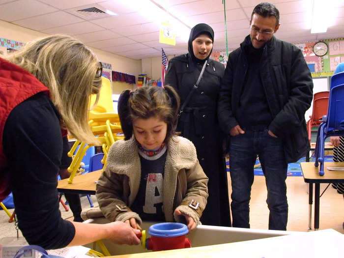 2017: Kindergarten teacher Susan Cody of the Northwest Primary School in Rutland, Vermont, showed Syrian refugee Dania Khatib, 5, around a classroom.