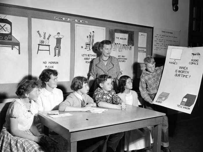 1951: A teacher shows students media and time management.