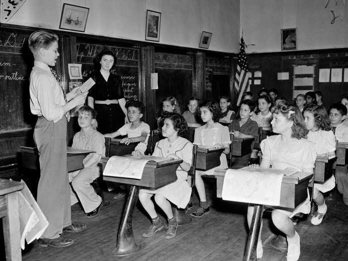 1944: A student named Dan Moss presented the news of D-Day to a classroom of younger students.