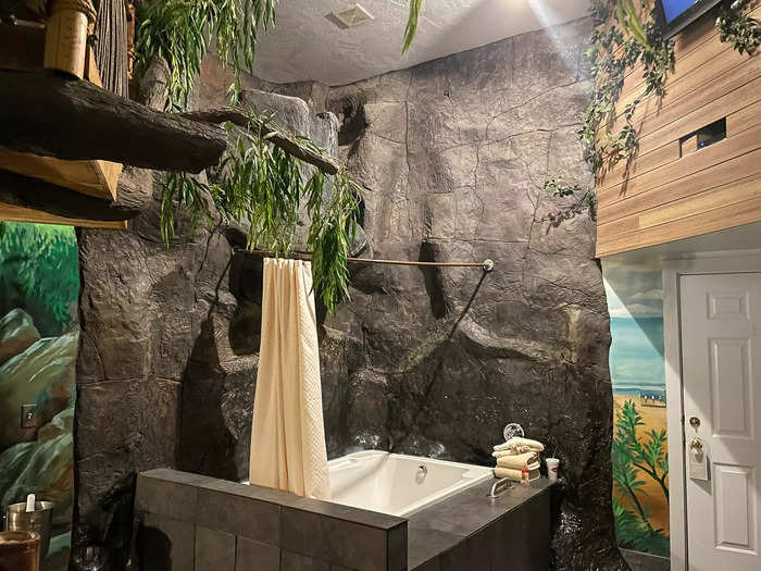 In the middle of the room was a waterfall tub with easily enough space for two people.