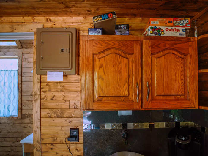 Above the cabinets full of dishes, I noticed stacks of board games I would have played had I brought a buddy on my trip.