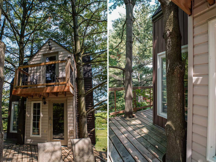 At the top of the steps, a porch stretches around to the back and side of the house.