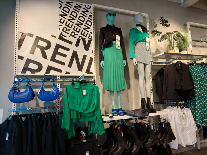 Behind them was a section dedicated to "trending" items, which included mainly green and black clothes with some splashes of bright red and blue.