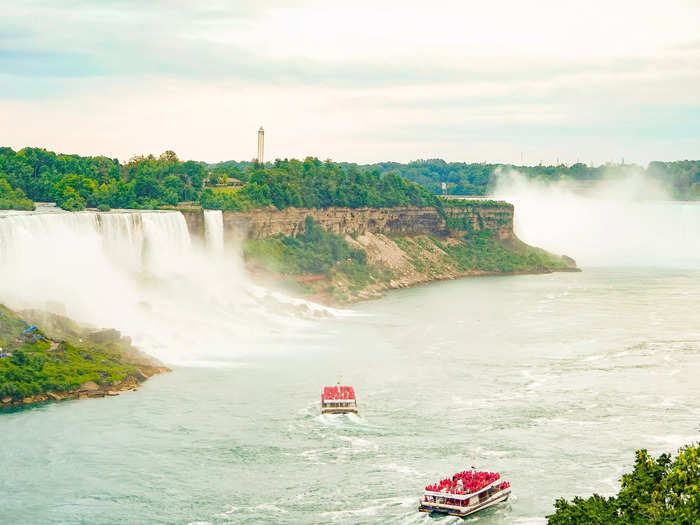 Niagara Falls is an iconic landmark of massive waterfalls located on the border between the US and Canada. It