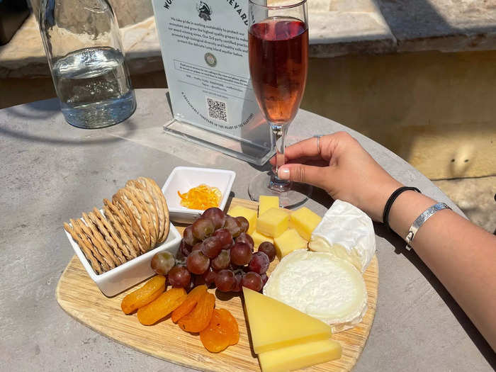 I spent $35 on a cheese board and $10 on a glass of non-alcoholic sparkling wine at Wölffer Estate Vineyard.