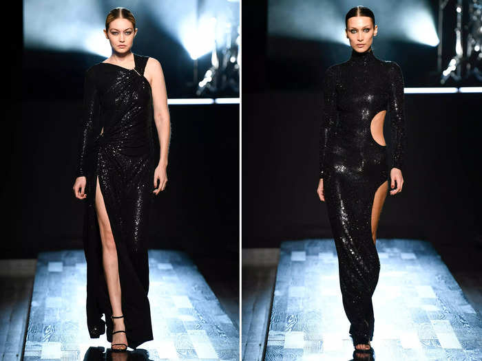 Once again in complementary gowns with matching hair, Gigi and Bella walked the Michael Kors fall/winter 2022 runway show in black sequinned gowns.