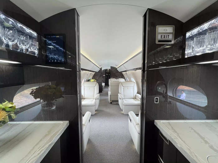 The 47-foot cabin includes a galley, where flight attendants prepare food and drinks…