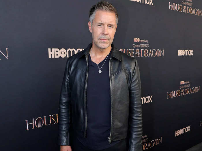 Paddy Considine has short, dark, salt-and-pepper hair, but he rocks the same facial hair as his character.