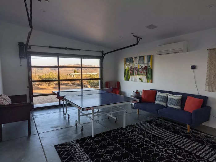 The house features floor-to-ceiling windows that showcase the natural landscape and the desert sights.