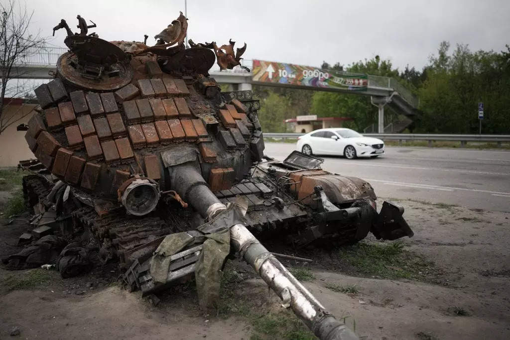 A destroyed Russian main battle tank rusts next to the main highway into the city on May 20, 2022 in Kyiv, Ukraine