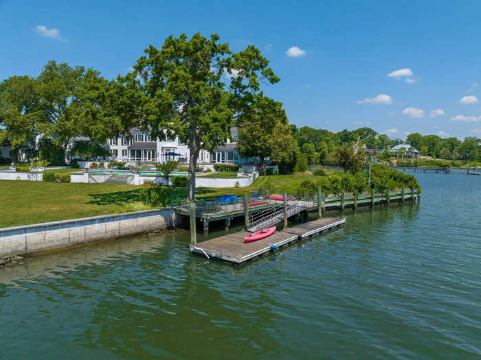 Perched on the tip of a peninsula, the home overlooks the Long Island Sound and comes with a deep water dock.