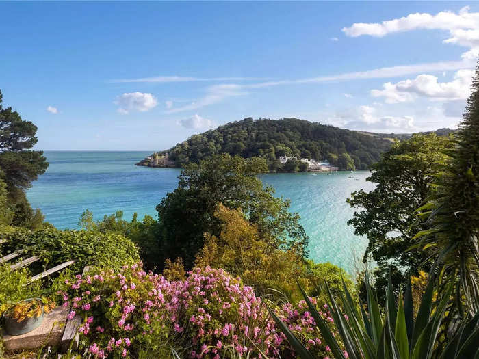 The four-bedroom property has scenic views of the River Dart and is one mile away from Dartmouth, a town in Devon.