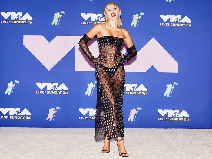 Miley Cyrus returned to the VMAs red carpet in 2020 wearing a see-through dress covered in tiny mirrors.