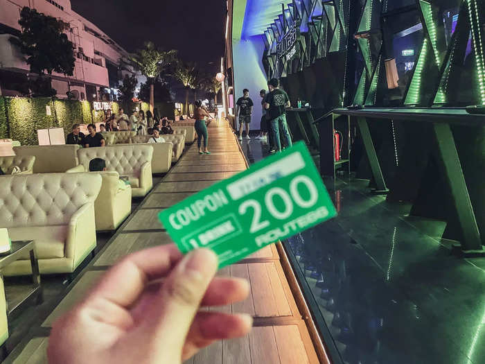 I paid the 200 baht, or $5.60, cover charge (which included one drink and the COVID-19 test), and made my way into the club. A few dozen people were lounging on plush couches outside the club.