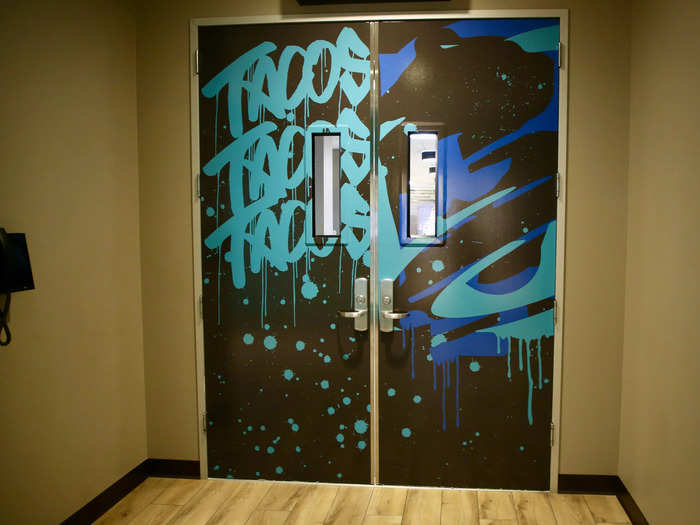 I took an elevator upstairs, and walked through these graffiti-style doors that said "tacos tacos tacos."