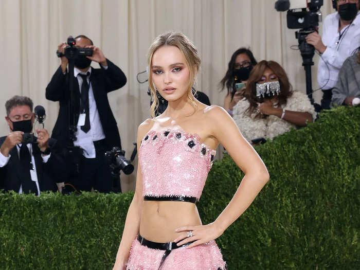 In 2021, Lily-Rose Depp attended the Met Gala in a sparkly bubblegum-pink bralette and skirt with black detailing.