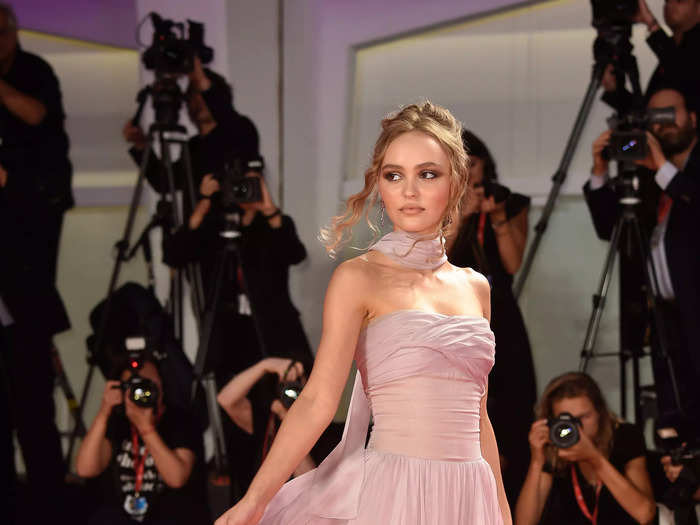 Lily-Rose Depp wore a pink silk chiffon gown at the 2019 Venice Film Festival.