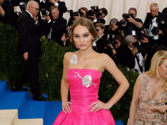 Returning to the Met Gala in 2017, Depp brought a pop of color to the event in a bright-pink gown with silver flowers.