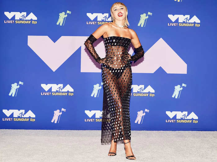 Cyrus stunned in 2020 when she hit the VMAs red carpet in a see-through dress covered in tiny mirrors.