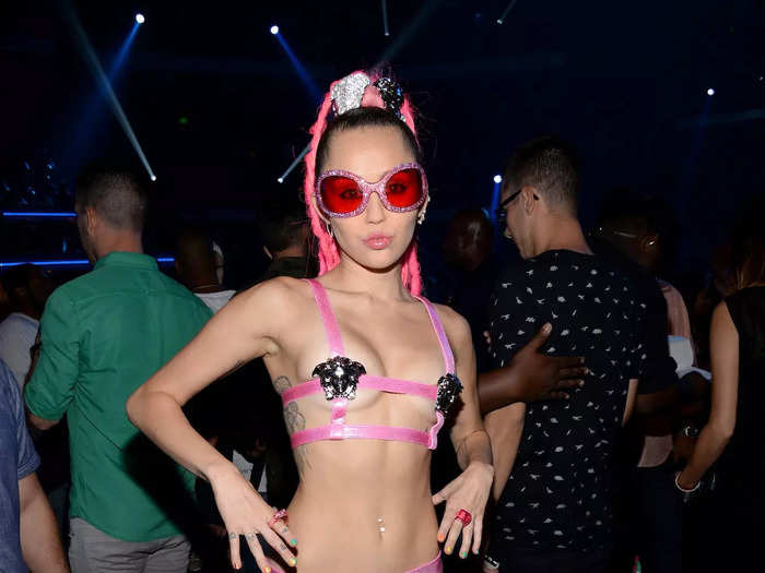 She later switched into a pink Versace set that didn