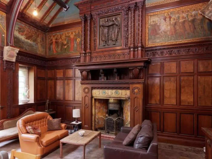 The atmospheric wood-paneled drawing room.