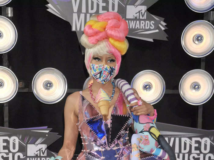 Nicki Minaj wore an extravagant ensemble including a minidress and endless random items for the 2011 awards.