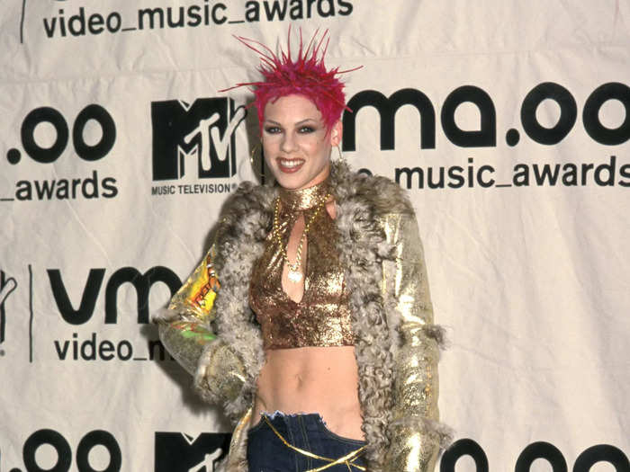 In 2000, Pink lived up to her name with vibrant spiky hair and an interesting combination of safety-pinned jeans and a fur coat.