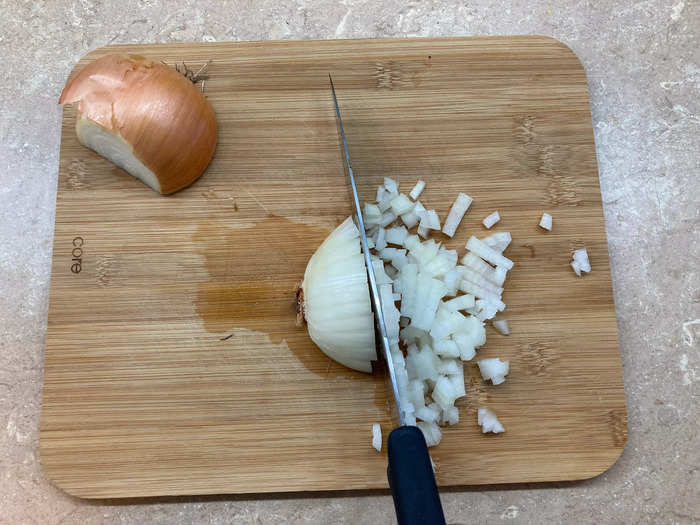 To dice an onion into perfectly uniform pieces every time, I make a series of cuts as instructed by Le Cordon Bleu chef Alma Regalado on TikTok.