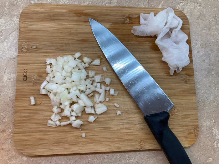 A damp paper towel prevents my eyes from watering while cutting onions.