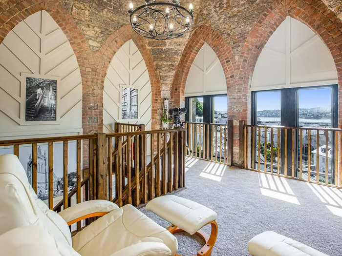 A formerly "secret staircase" leads to the church tower, which has been converted into a living area with views of Torquay.