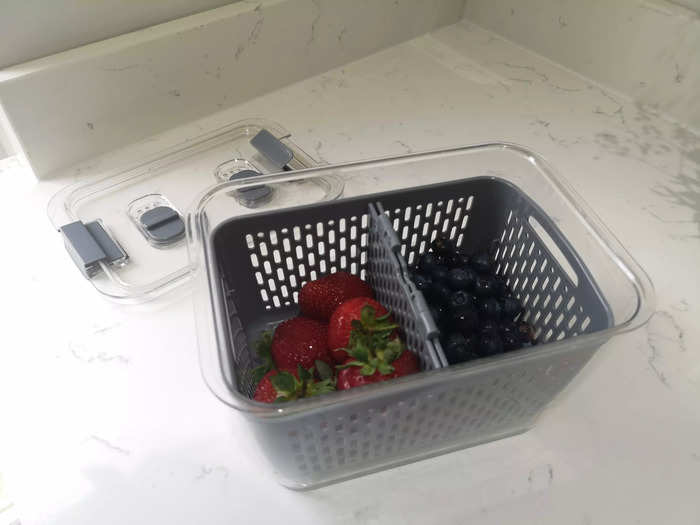 Swapping out plastic fruit packaging for fresh produce storage boxes allows you to wash fruit ahead of eating it, and store it in the fridge.