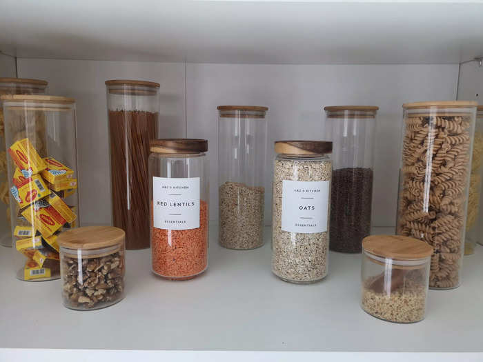 Clear jars with personalized labels can be a nice touch to improve the appearance of your cabinets, and also make it easier to locate ingredients when cooking.