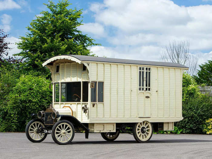 The exterior of the motorhome mimics a railroad carriage.