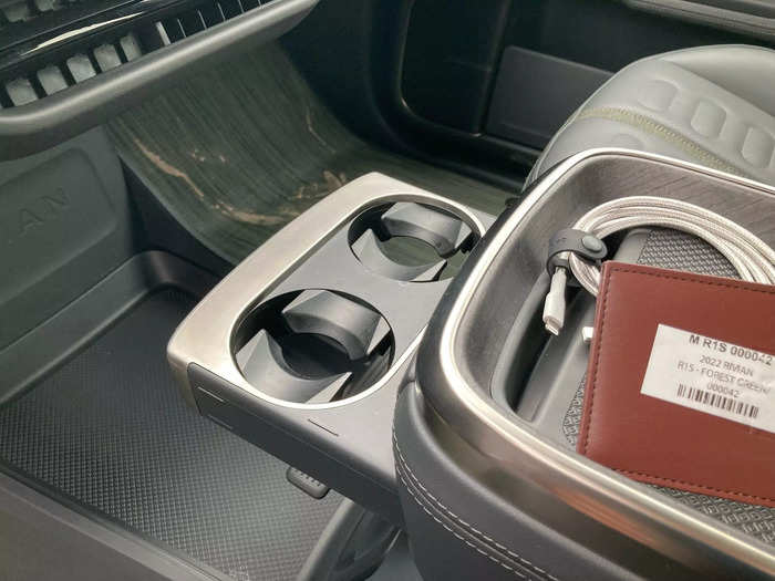 A pair of cup holders slide out when needed.