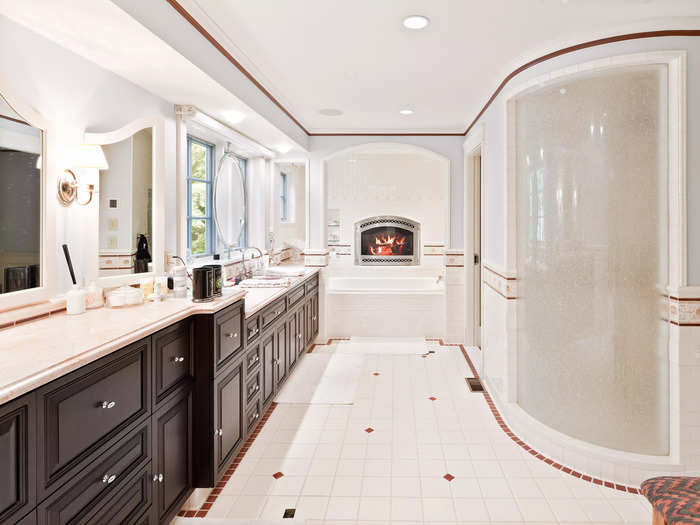 The main residence also has six full bathrooms and five half-bathrooms spread out between five bedrooms. The house features 11 fireplaces, including ones in some of the bathrooms.