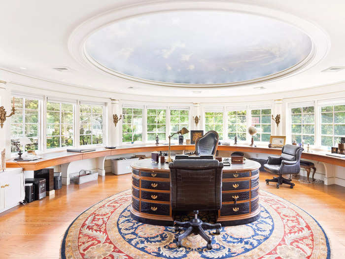 The house features an "oval office" surrounded by windows that offer views of the estate