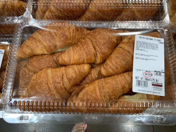 The bakery aisle is stocked with treats like buttery croissants.