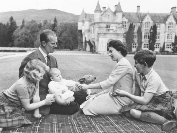 1960: Here, the royals are pictured enjoying some family time at Balmoral Castle.