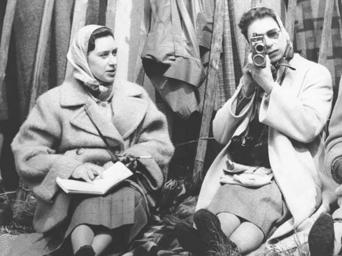 1957: In this photo, the Queen and her sister, Princess Margaret, enjoy a day out at the horse shows in Badminton, Gloucestershire.