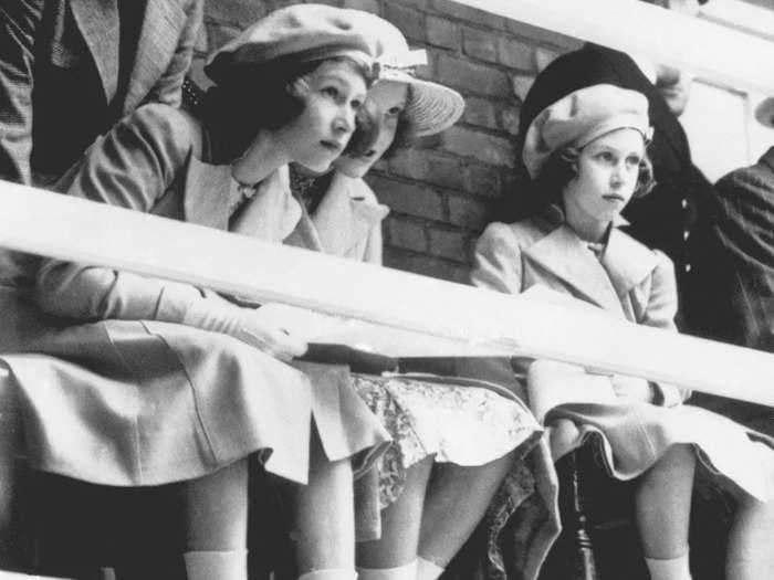 1939: Elizabeth and Princess Margaret went to watch a swimming display given before the royal visitors at Dartmouth Naval College, on July 22, 1939.